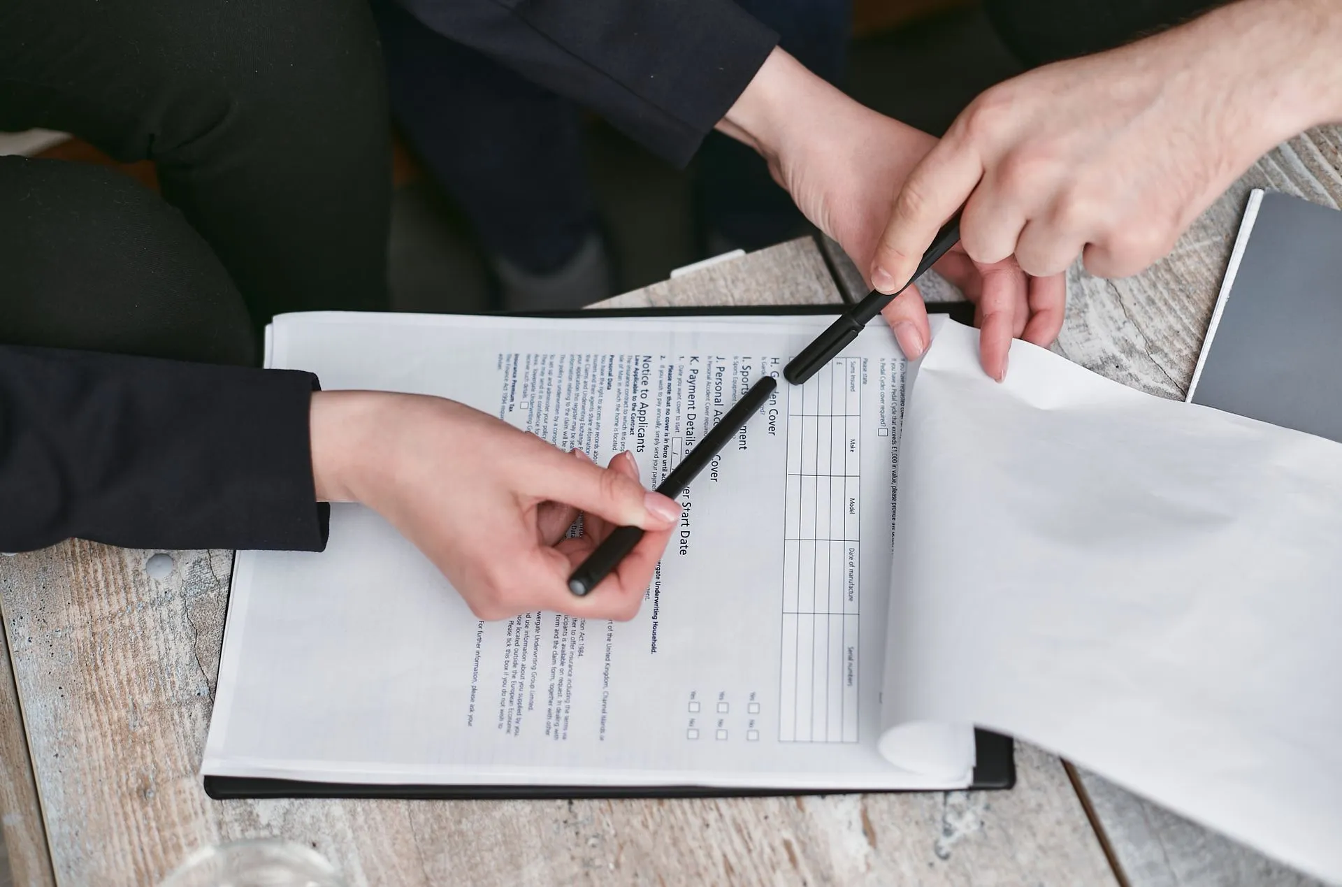 Hands finalizing a property agreement